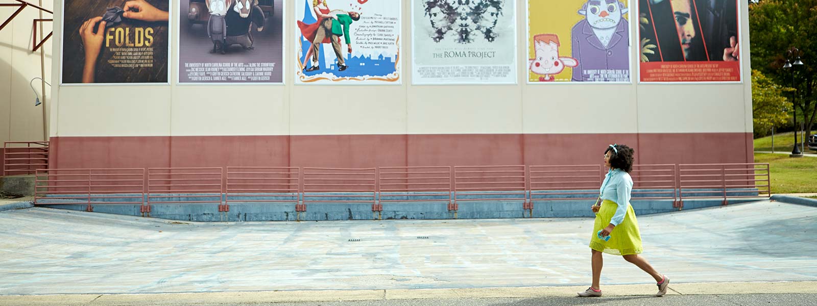 student walking in Film Village