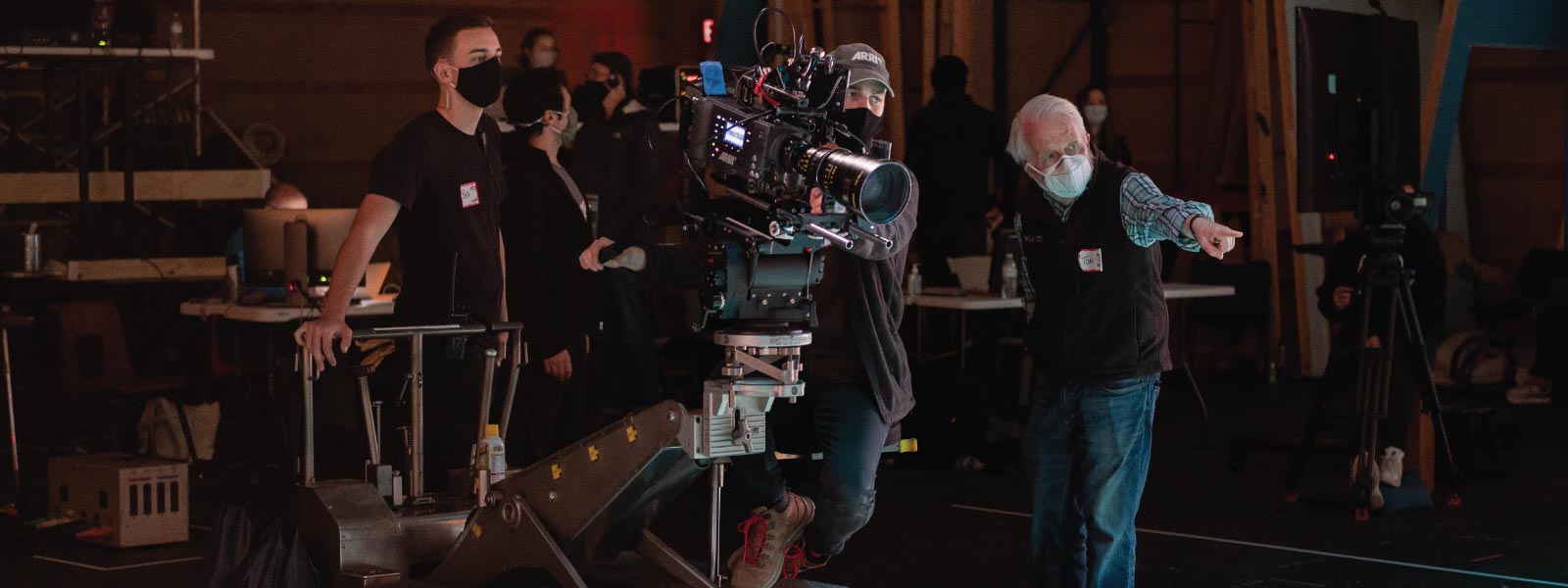 students and faculty member on a film set