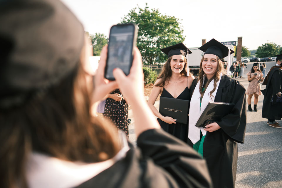 UNCSA graduates taking photos at commencement