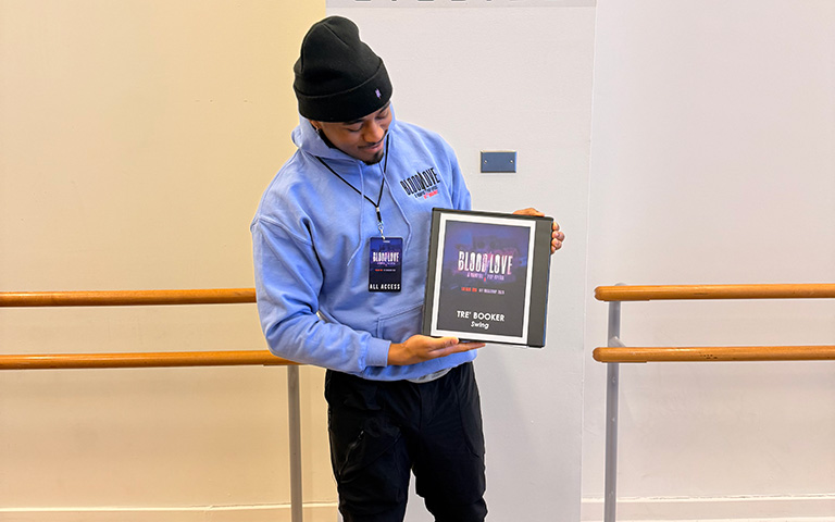 Tre Booker with his BlOOD/LOVE cast book