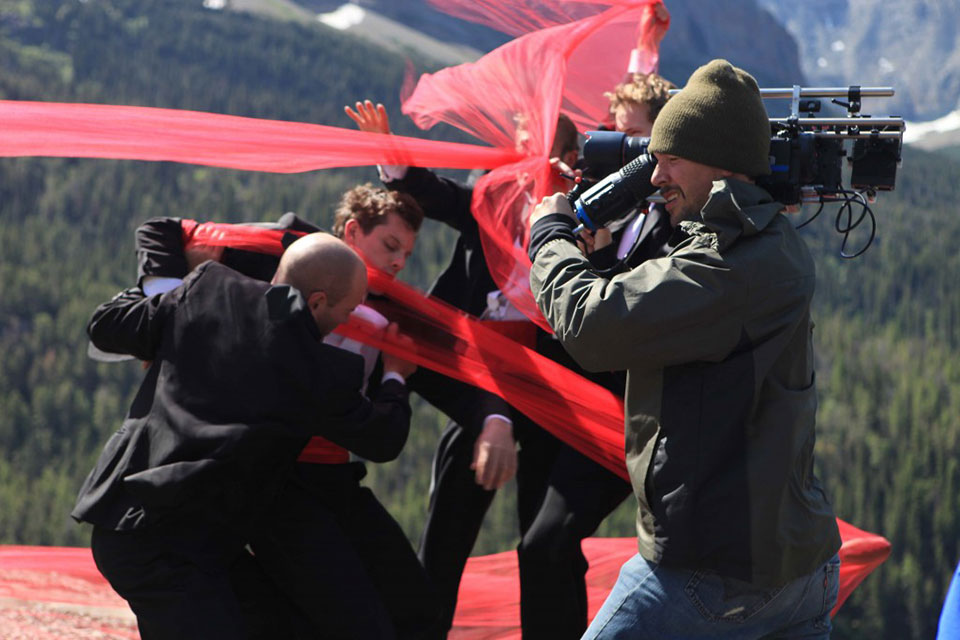 Trey McIntyre operating a camera on a film set