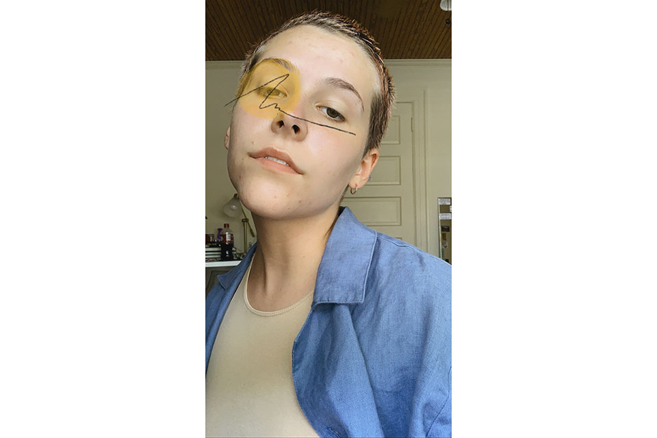 Ticket selfie with a circle and scribble over their left eye