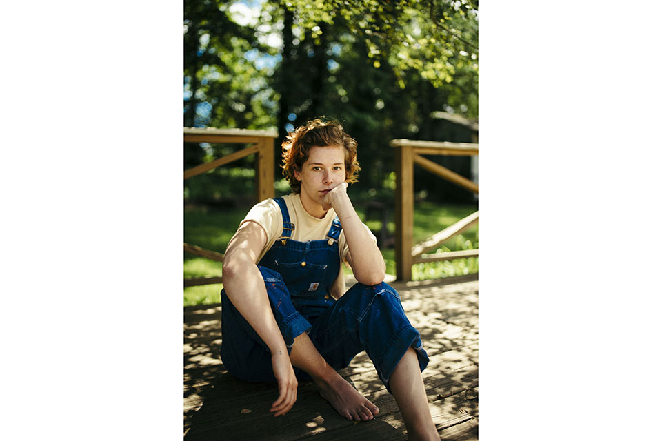 Ticket sitting outdoors, looking at camera