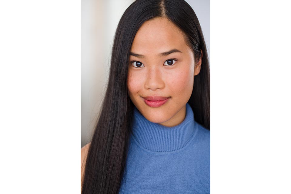 Isabelle Bushue headshot in blue shirt