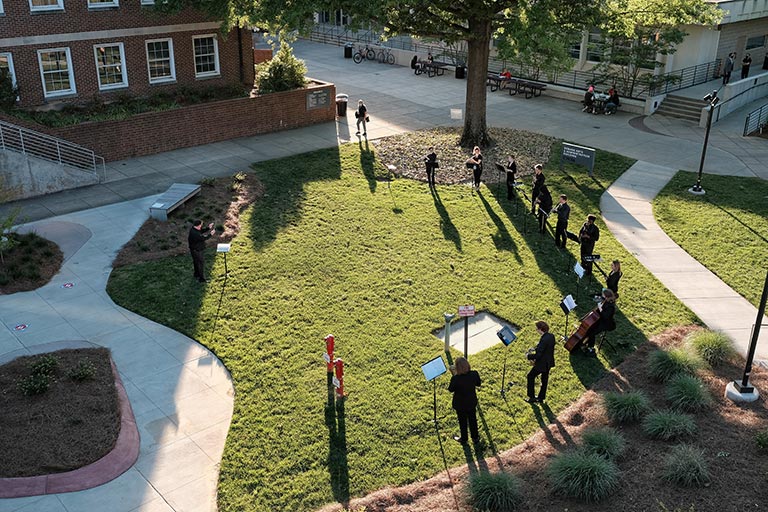 Students performing music outdoors at UNCSA