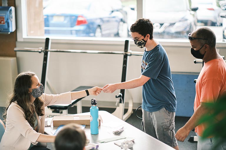 Student checking in with Health staff during move-in