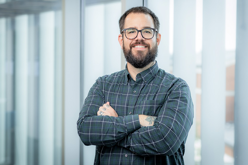 Louie Poore posed with arms crossed and a smile