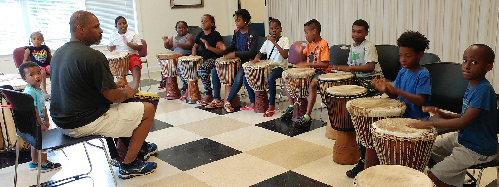 Wesley Williams leads a drumming class during the Happy Hill Summer Arts Program in July 2017.