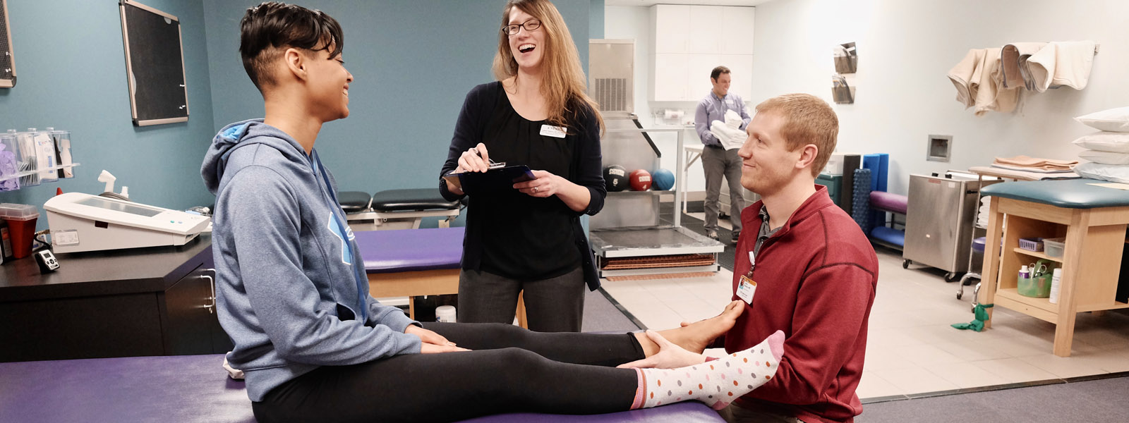 Student working with athletic trainers from UNCSA and Wake Forest Baptist Heal