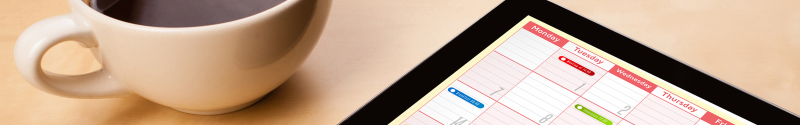 calendar near a coffee cup