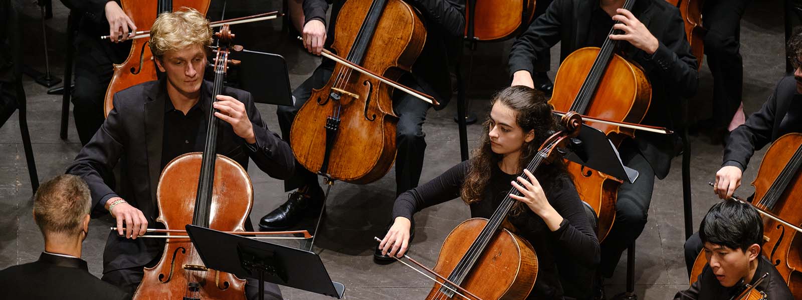 Jake Anderson (left) paying cello at the 2022 UNCSA Symphony Orchestra with Robert Franz / Photo: Wayne Reich