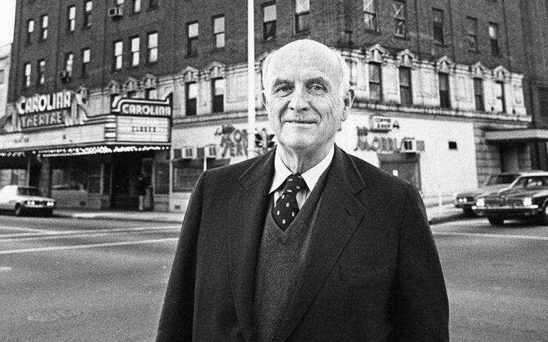 Roger L. Stevens standing in front of the Carolina Theatre