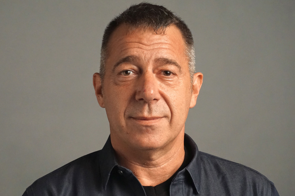 A man smiling at the camera