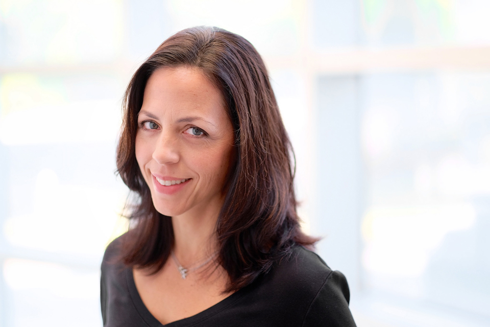 A woman smiling at the camera.